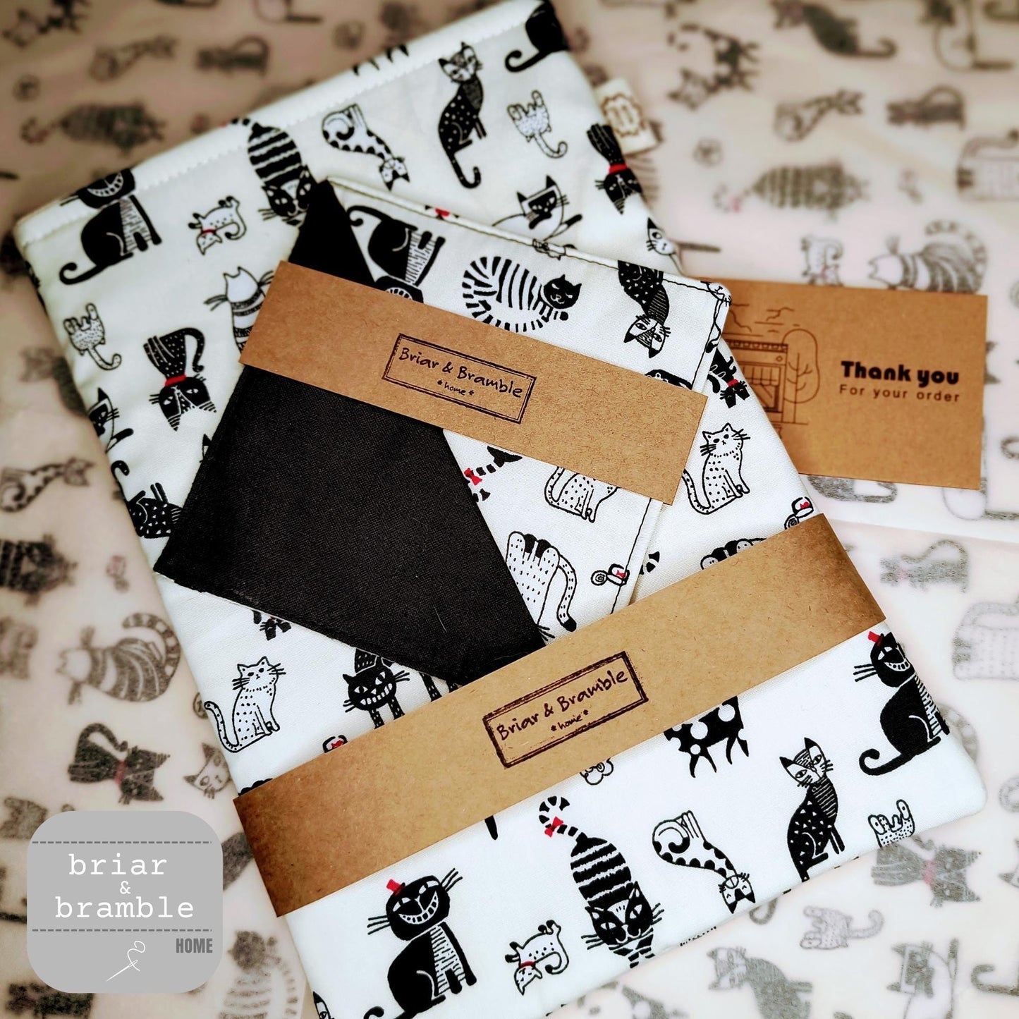 Book Sleeve and Book Mark Gift Set Duo. The fabric is white cotton with black animated cats.